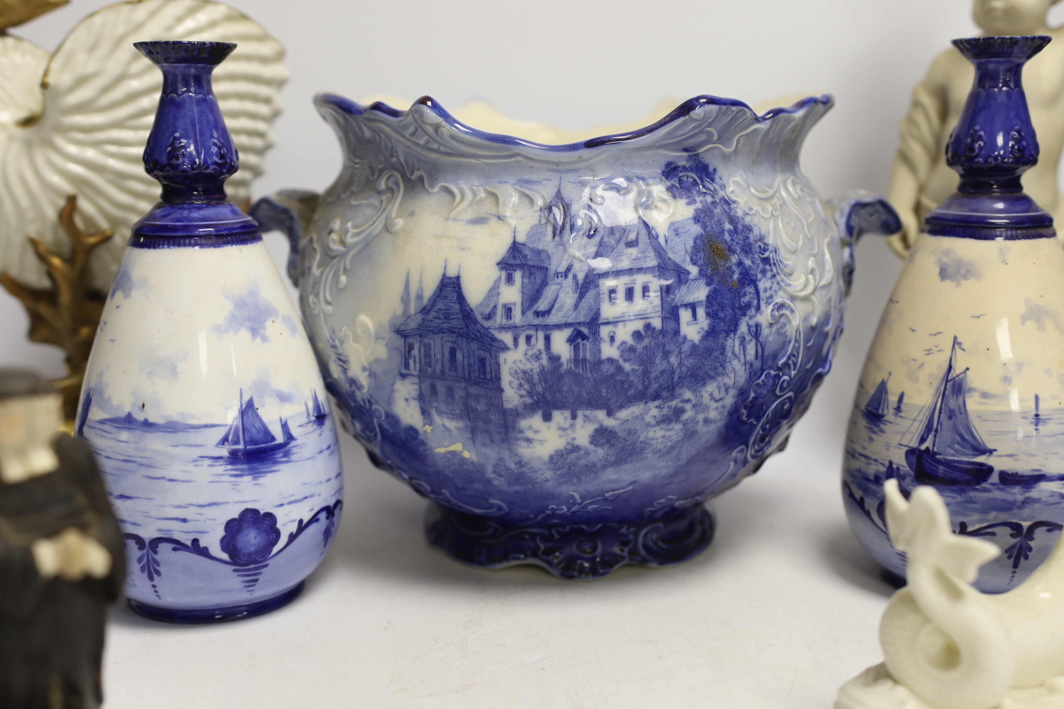 A 19th century Staffordshire Tithe Pig group, a pair of Royal Crown Derby blue and white vases, a Royal Worcester nautilus shell centrepiece and three other items, 32cm high